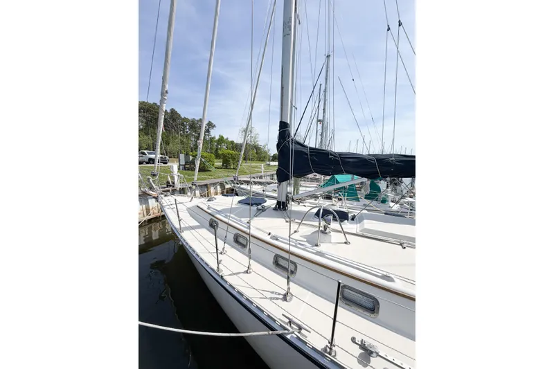 Slide: The Image of Sailboat docked at marina, 2001 Caliber 40LRC model, clear sky background. - 8