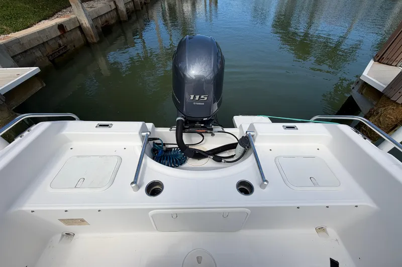Slide: The Image of 2017 Release 196 RX boat with Yamaha 115 engine at dockside. - 11