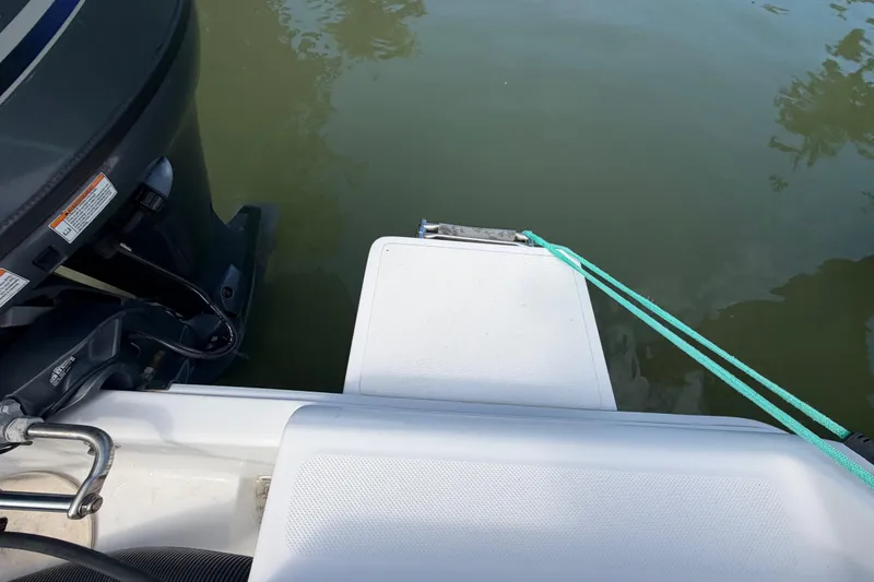 Slide: The Image of Boat stern with motor and teal rope, Release 196 RX, 2017 model. - 15