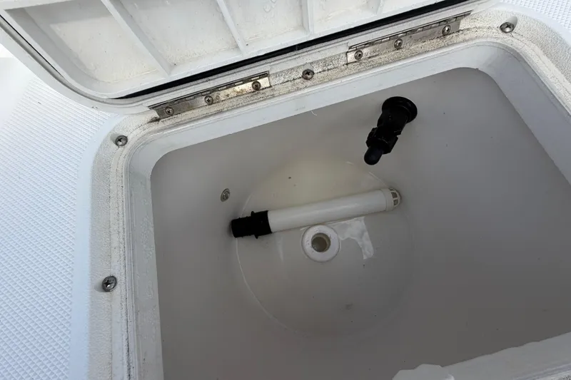 Slide: The Image of Open compartment of a 2017 Release 196 RX boat, showing interior details. - 18