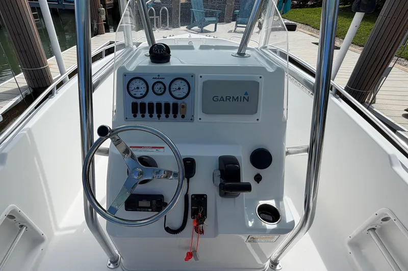Slide: The Image of Steering console of a 2017 Release 196 RX boat with Garmin navigation system. - 19