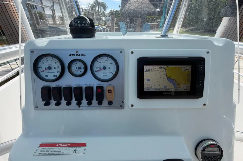 Slide: The Image of 2017 Release 196 RX boat dashboard with gauges and Garmin GPS navigation system. - 22