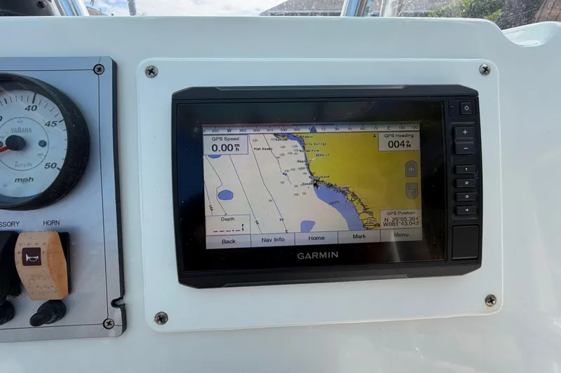 Slide: The Image of Boat dashboard with Garmin GPS and Yamaha speedometer on a 2017 Release 196 RX. - 24