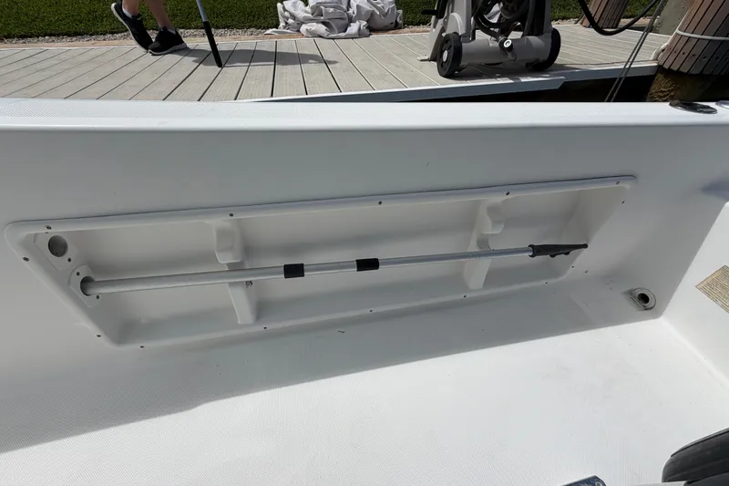 Slide: The Image of Interior view of a 2017 Release 196 RX boat, featuring a storage compartment. - 30