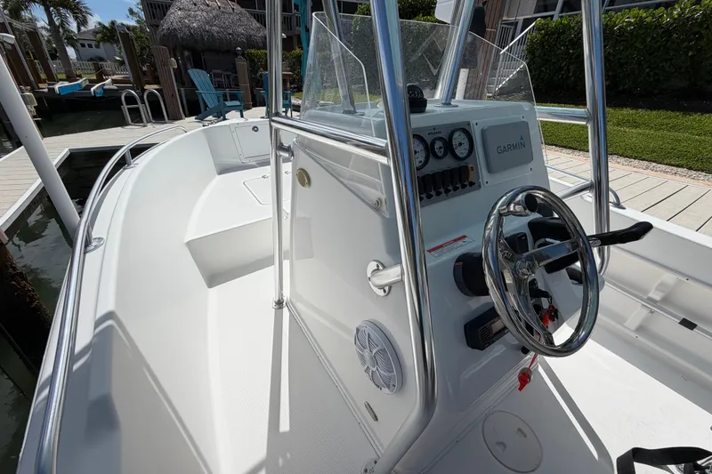 Slide: The Image of 2017 Release 196 RX boat interior with steering wheel and control panel. - 32