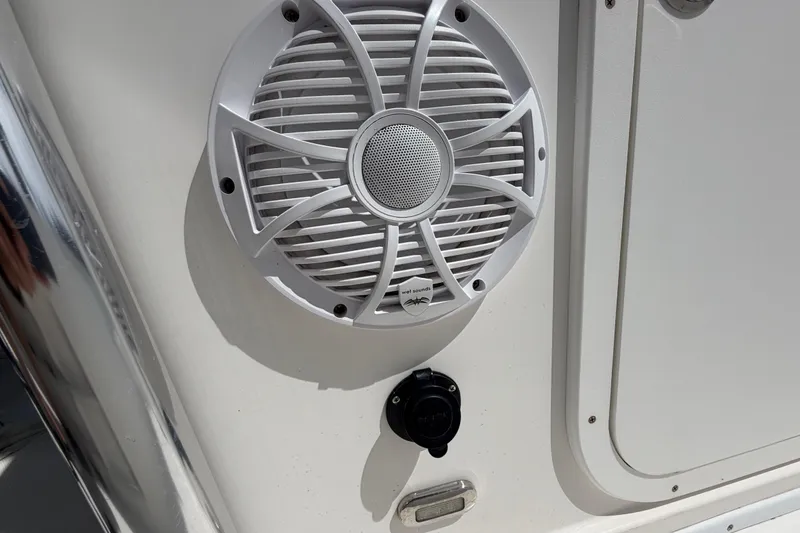 Slide: The Image of White marine speaker on 2017 Release 196 RX boat exterior. - 35