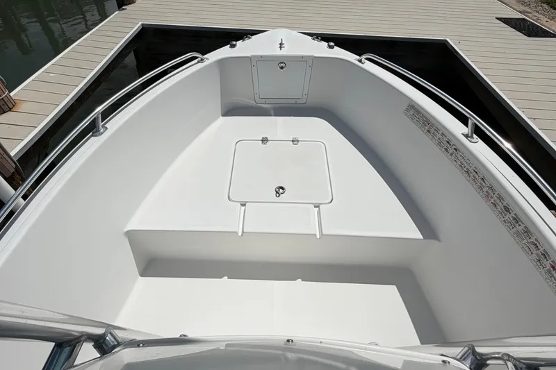 Slide: The Image of 2017 Release 196 RX boat bow with storage compartment at dock. - 39