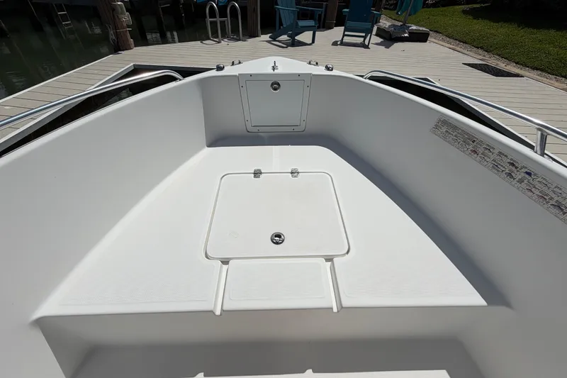 Slide: The Image of Bow of a 2017 Release 196 RX boat docked at a marina. - 41