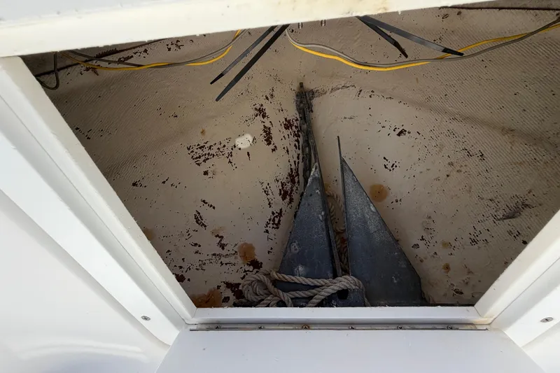 Slide: The Image of Storage compartment of a 2017 Release 196 RX boat with anchors and ropes. - 43