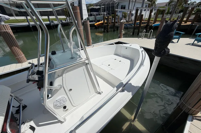 Slide: The Image of 2017 Release 196 RX boat docked in a marina, featuring a sleek white design. - 47