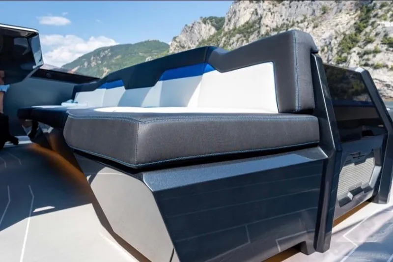 Slide: The Image of Luxury seating on 2026 Tecnomar LY63 yacht, with scenic mountain backdrop. - 6