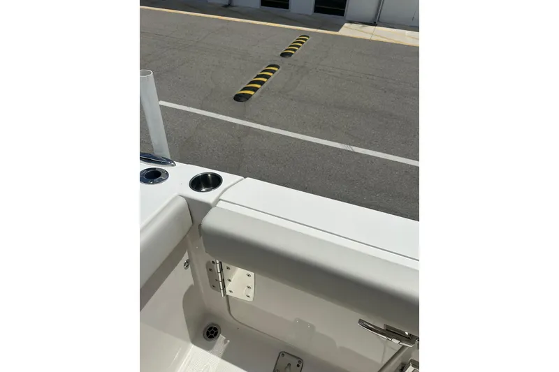 Slide: The Image of 2026 Sailfish 272 CC boat interior with cup holders and seating detail. - 10