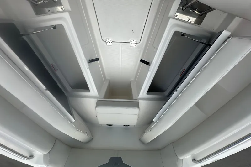 Slide: The Image of Interior view of 2026 Sailfish 272 CC boat storage compartments. - 11