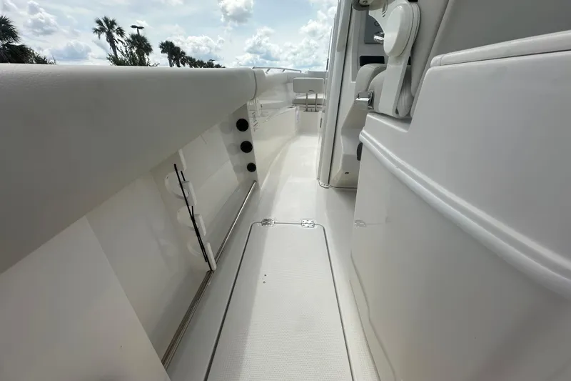 Slide: The Image of 2026 Sailfish 272 CC boat interior, showcasing sleek white deck and seating area. - 19