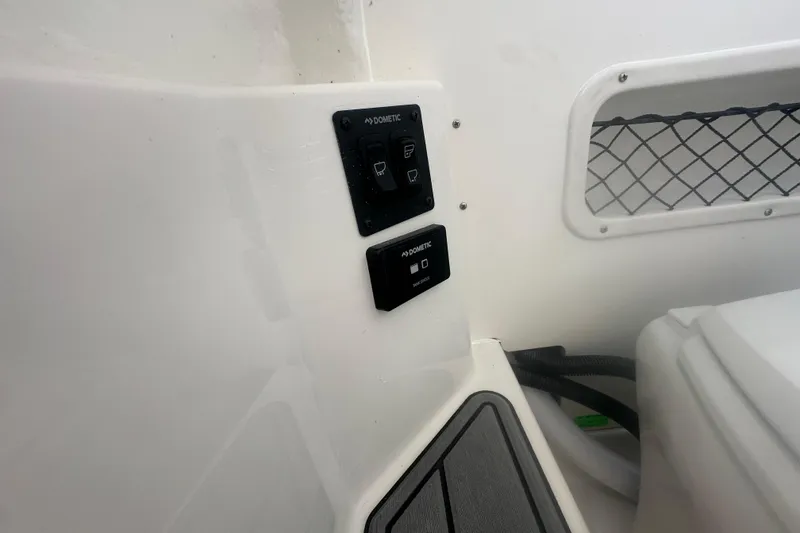 Slide: The Image of Control panel on 2026 Sailfish 272 CC boat interior with Dometic switches. - 20