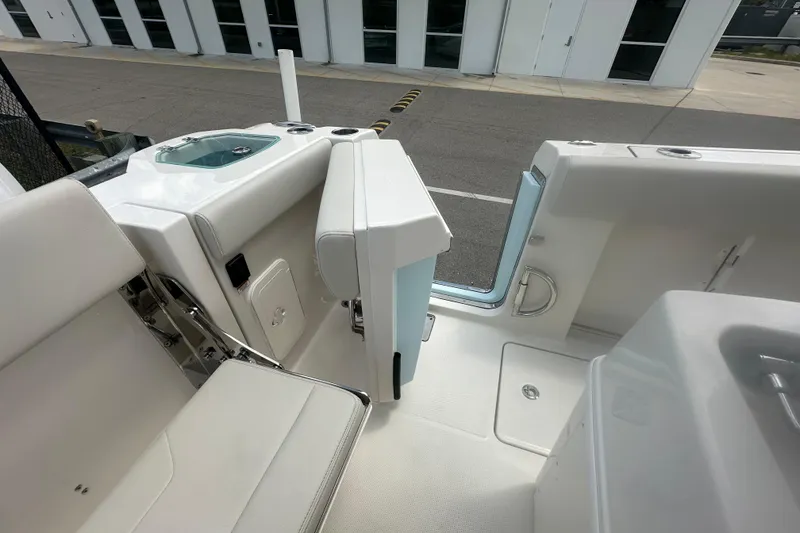 Slide: The Image of Interior view of 2026 Sailfish 272 CC boat, featuring seating and storage compartments. - 21