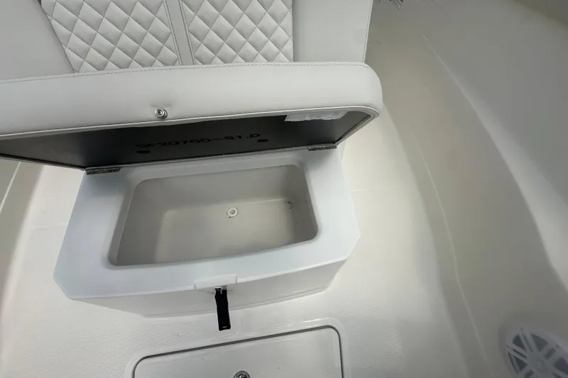 Slide: The Image of 2026 Sailfish 272 CC boat storage compartment with quilted seat design. - 24