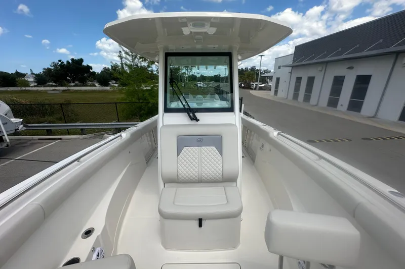 Slide: The Image of 2026 Sailfish 272 CC boat interior with cushioned seating and modern design. - 25