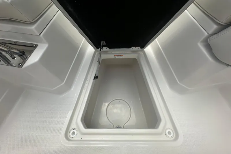 Slide: The Image of Open storage compartment on 2026 Sailfish 272 CC boat, showcasing interior space. - 26