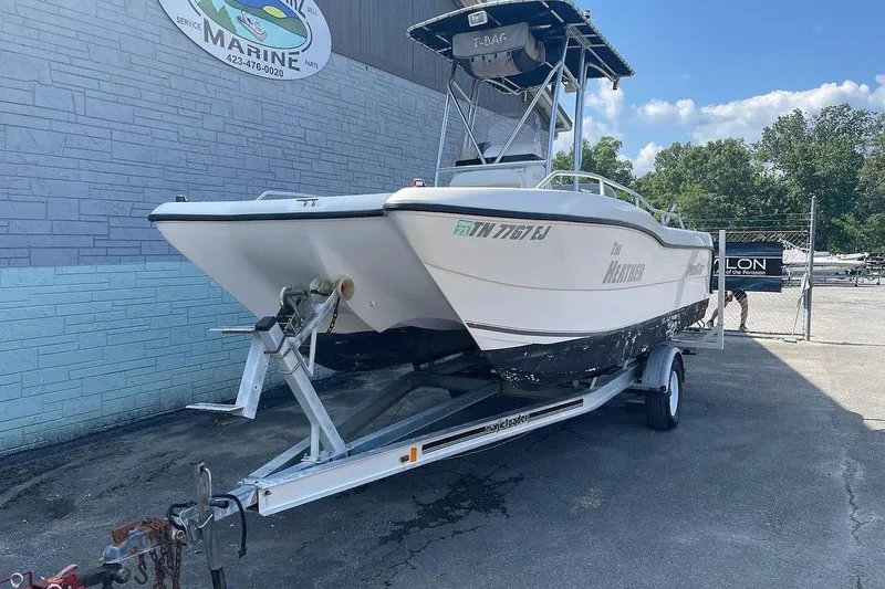The Image of 2007 ProKat CS200 boat on trailer outside marine service center. - 1