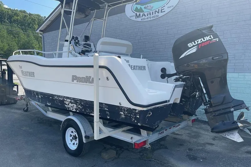 Slide: The Image of 2007 ProKat CS200 boat with Suzuki outboard motor on trailer. - 3