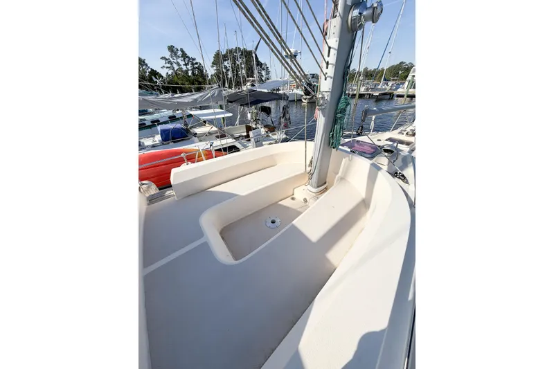 Slide: The Image of 2007 Island Packet SP Cruiser sailboat deck with seating and rigging in marina. - 17