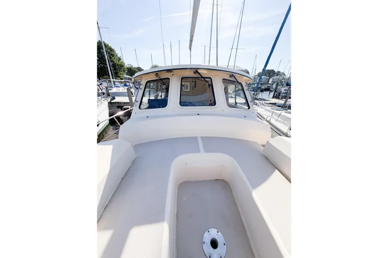 Slide: The Image of 2007 Island Packet SP Cruiser sailboat deck view in marina setting. - 21