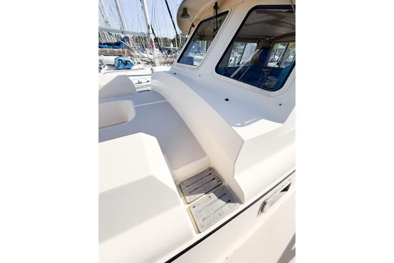 Slide: The Image of 2007 Island Packet SP Cruiser deck view with windows and seating area. - 22