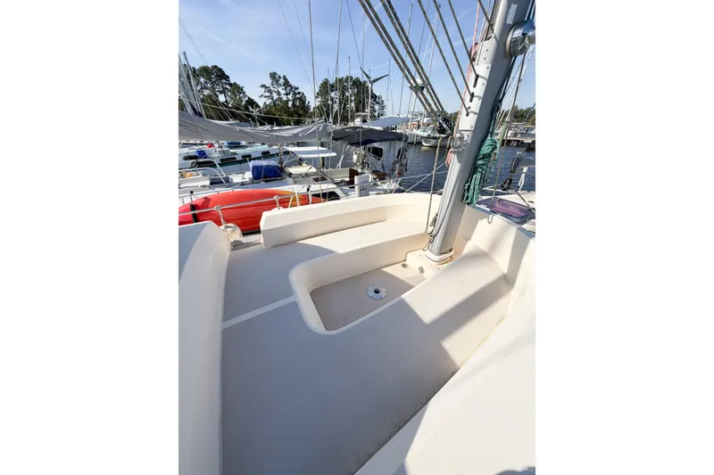 Slide: The Image of 2007 Island Packet SP Cruiser deck with seating, docked at marina. - 23