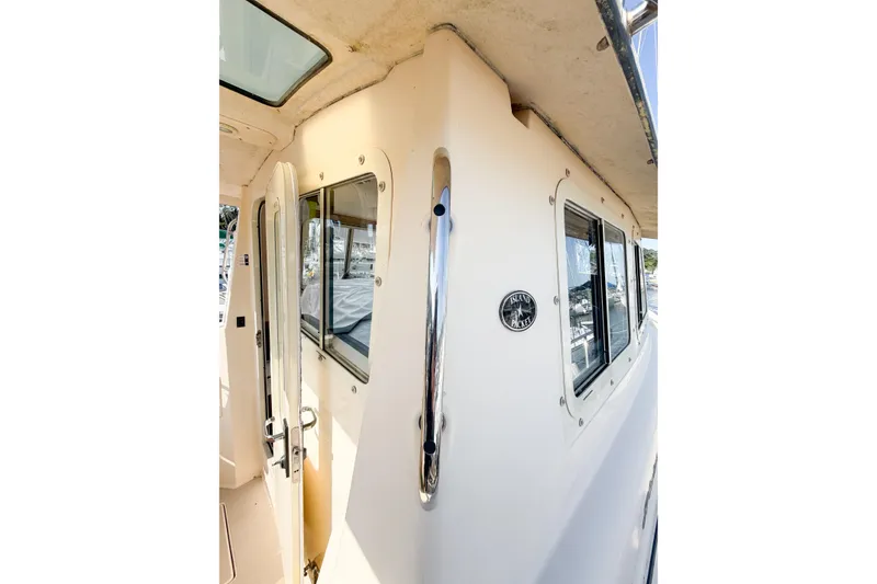 Slide: The Image of 2007 Island Packet SP Cruiser exterior with windows and door, showcasing sleek design. - 24