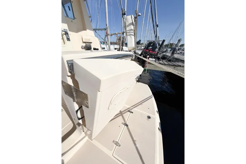 Slide: The Image of 2007 Island Packet SP Cruiser deck with marina view and sailboat masts. - 25