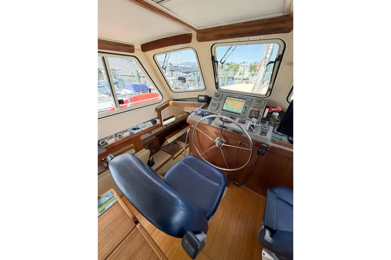 Slide: The Image of 2007 Island Packet SP Cruiser helm with navigation equipment and comfortable seating. - 37