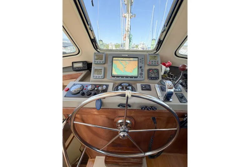 Slide: The Image of 2007 Island Packet SP Cruiser helm with navigation equipment and steering wheel. - 39