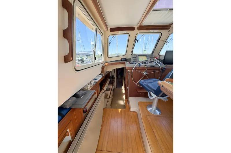 Slide: The Image of Interior of 2007 Island Packet SP Cruiser, featuring helm station and navigation equipment. - 41