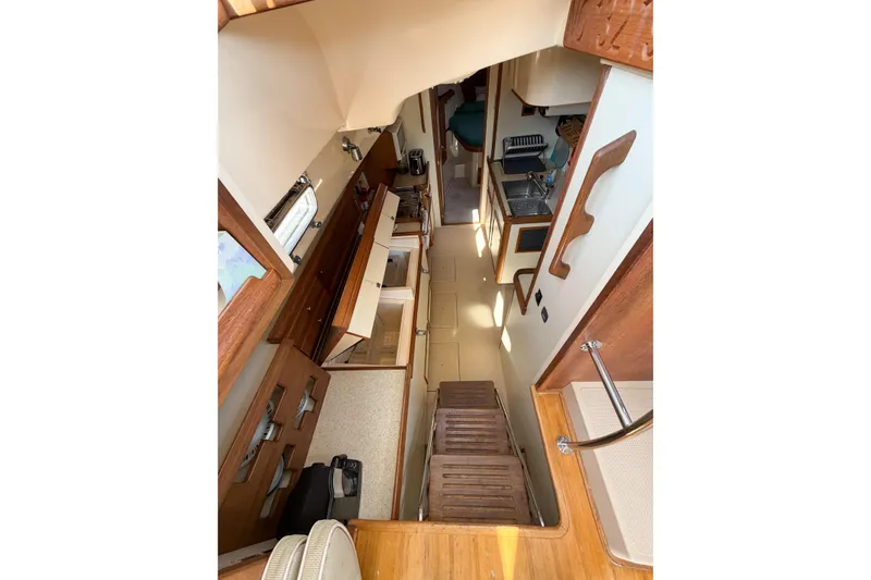 Slide: The Image of Interior view of 2007 Island Packet SP Cruiser, showcasing kitchen and living area. - 42