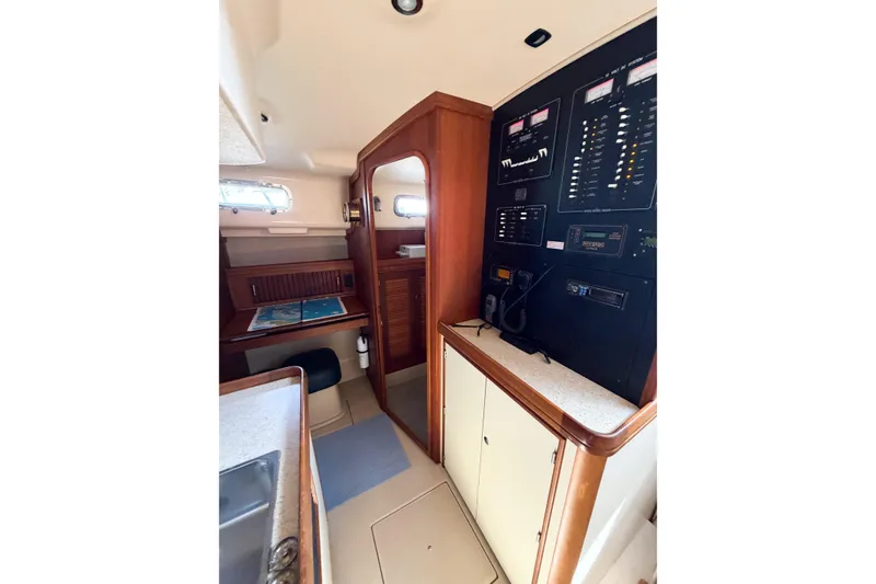 Slide: The Image of 2007 Island Packet SP Cruiser interior with navigation station and control panel. - 44
