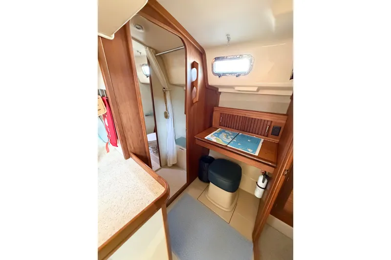 Slide: The Image of 2007 Island Packet SP Cruiser interior with navigation desk and compact bathroom. - 46