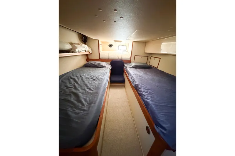 Slide: The Image of 2007 Island Packet SP Cruiser cabin with twin beds and cozy interior. - 50