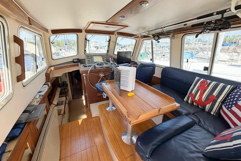 Slide: The Image of 2007 Island Packet SP Cruiser interior with nautical decor and helm station. - 70