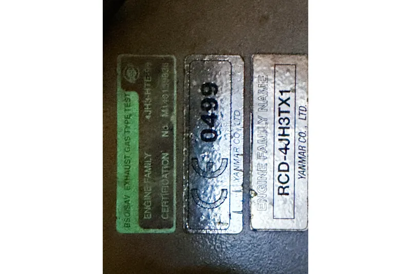 Slide: The Image of Yanmar engine certification labels on a 2007 Island Packet SP Cruiser. - 74