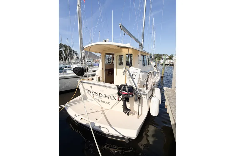 Slide: The Image of 2007 Island Packet SP Cruiser docked at marina, stern view with equipment. - 8