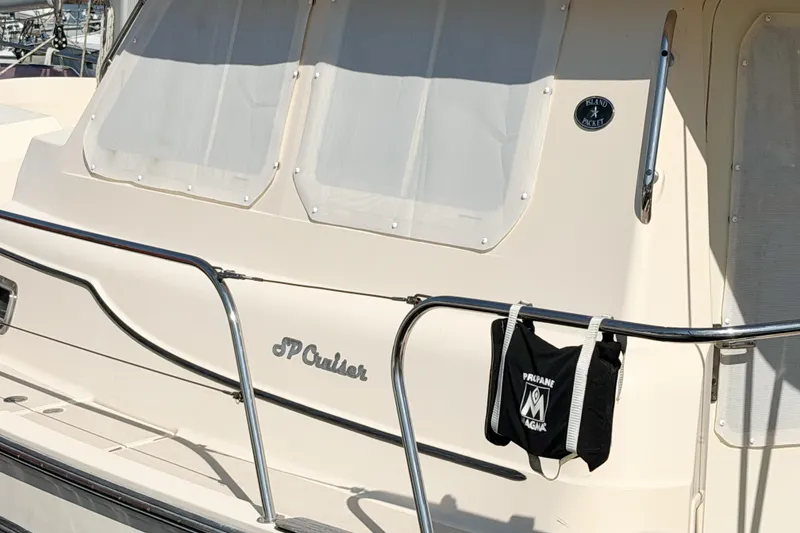 Slide: The Image of 2007 Island Packet SP Cruiser yacht with white exterior and railing. - 88