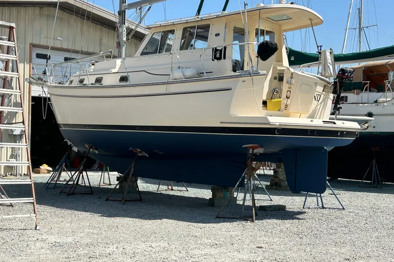 Slide: The Image of 2007 Island Packet SP Cruiser sailboat on stands in a boatyard. - 90