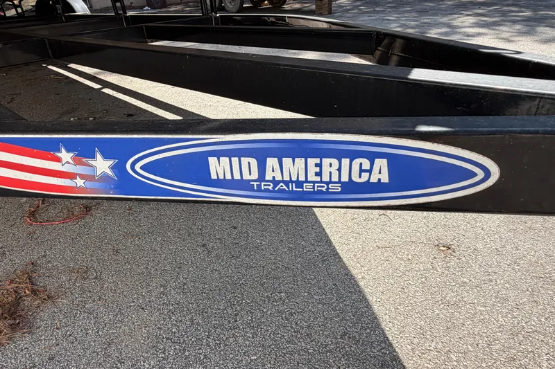 Slide: The Image of Mid America Trailers logo on a trailer frame, associated with 2019 Bentley Pontoons 250/253 Elite Admiral. - 15