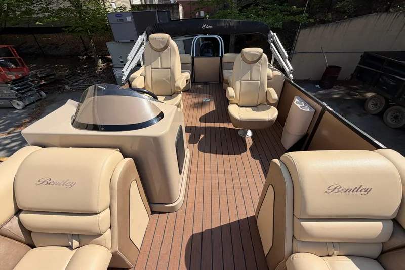 Slide: The Image of 2019 Bentley Pontoons 250/253 Elite Admiral with luxurious beige seating and sleek design. - 3