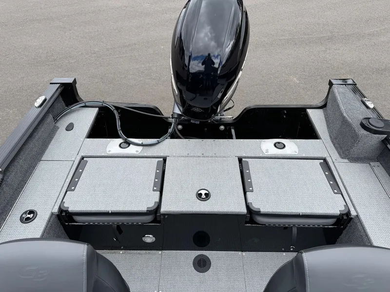 Slide: The Image of G3 Angler V164 C 2026 boat rear with motor and storage compartments. - 21
