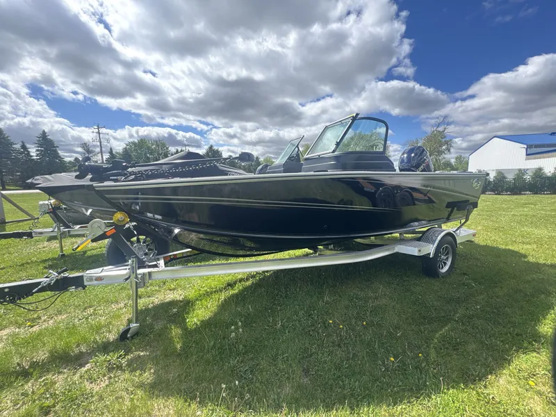 Slide: The Image of 2026 G3 Angler V1850 SF boat on trailer outdoors. - 2