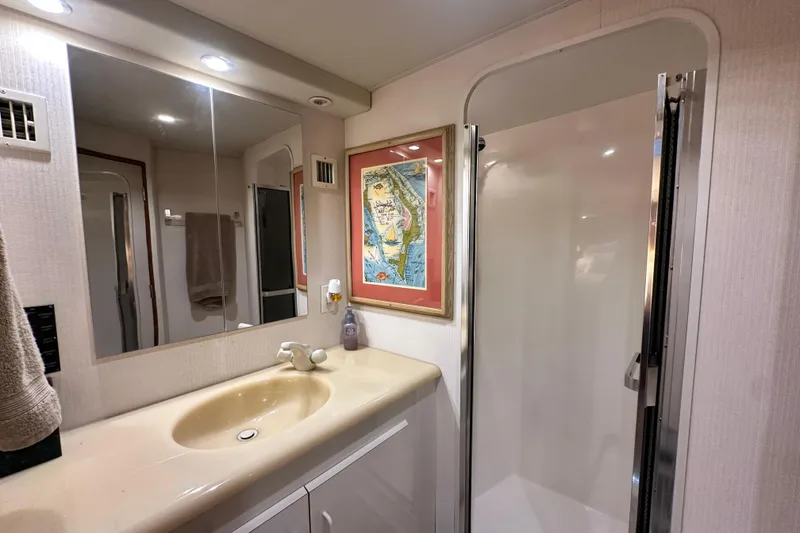 Slide: The Image of Bathroom interior of 1997 Viking 58 Convertible yacht with shower and sink. - 115