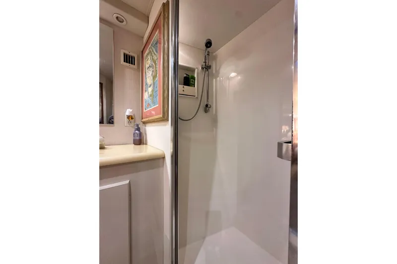 Slide: The Image of Shower area in 1997 Viking 58 Convertible yacht, featuring sleek design and modern fixtures. - 118