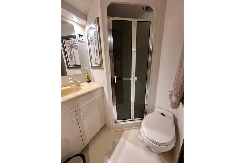 Slide: The Image of Bathroom interior of 1997 Viking 58 Convertible yacht with shower and toilet. - 145